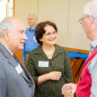 Friends chatting at the Retiree Reception.